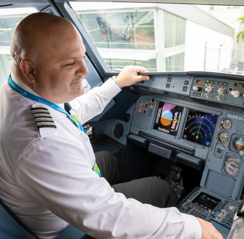 pilot at controls of aircraft